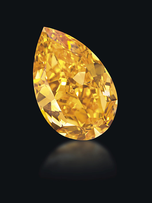 'The Orange,' a pear-shaped, fancy vivid orange, VS1 diamond of 14.82 carats. Estimate: SFr.16,000,000-19,000,000 / US$17,000,000-20,000,000 / €14,000,000-16,000,000. Price realized: SFr.32,645,000 / US$35,540,611 (US$2,398,151 per carat). World record price per carat for any colored diamond sold at auction, world auction record for a fancy vivid orange diamond. Photo: Denis Hayoun Diode SA Geneva.